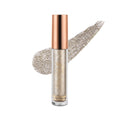 A tube of radiant liquid eye shadow with a rose gold cap and a swatch of the product showing its glittery texture.