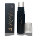 A black cosmetic stick product with a silver cap shown next to its black retail box and a clear cylindrical applicator cup on a white background.